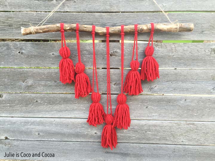 Easy Yarn Crafts from Julie is Coco and Cocoa. Yarn Pom Pom Flowers and Tassel Wall Hanging